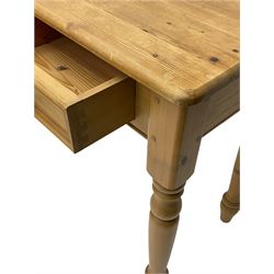 Traditional waxed pine side table, fitted with two drawers, on turned supports