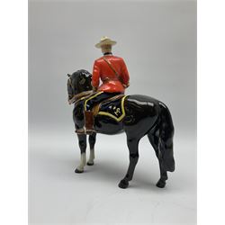 A model of a Canadian Mountie on horseback, probably Beswick, unmarked, H21.5cm. 