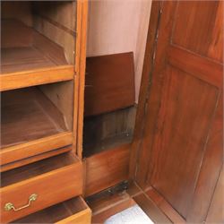 Aesthetic Movement walnut parcel gilt wardrobe, the crenellated top, above central mirrored door opening to reveal hanging space, four opened and two closed draws