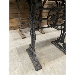 Four cast iron pub or bar tables with rectangular tops