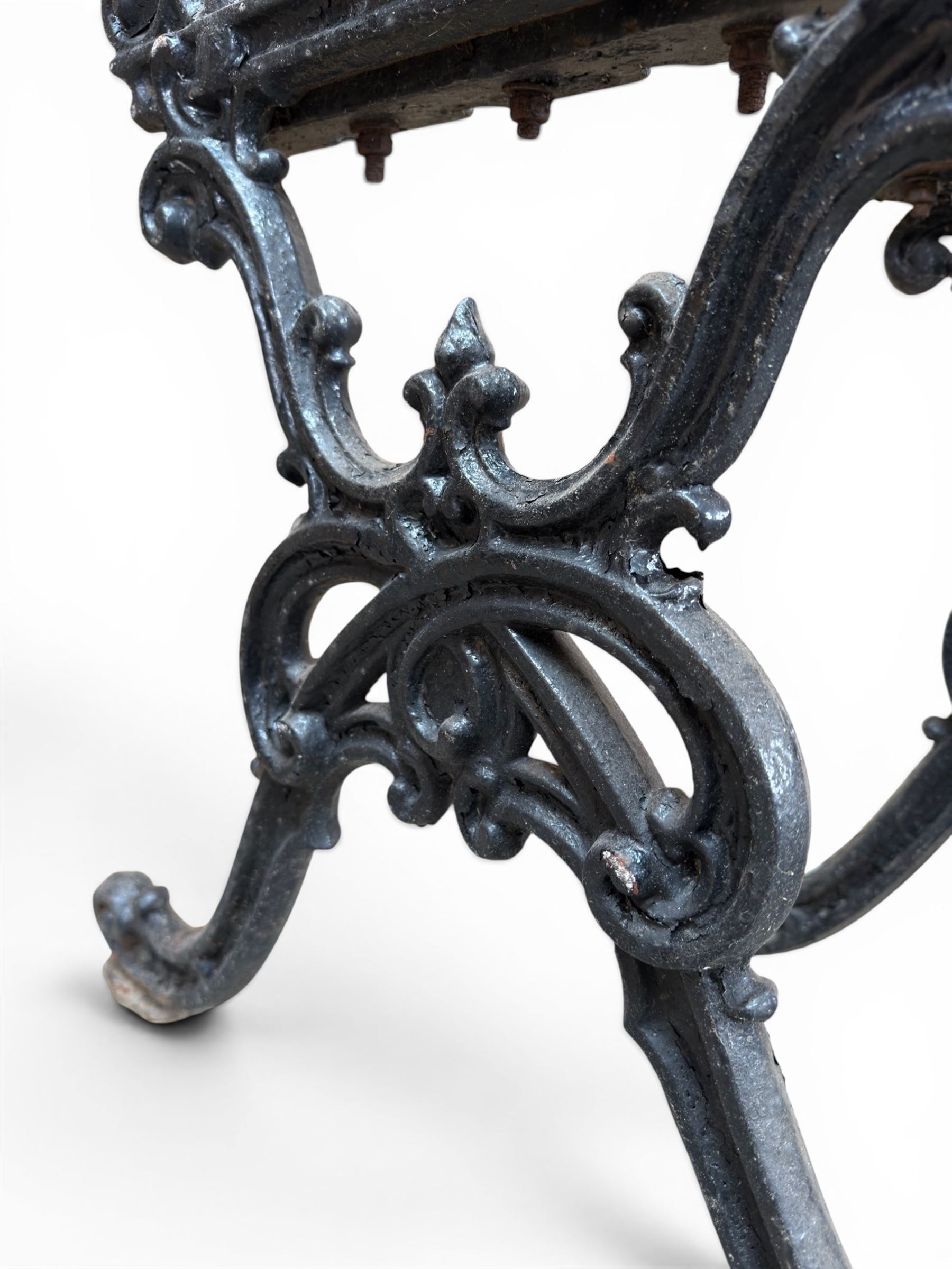 Carron Foundry - two pairs of 19th century cast iron garden bench ends, ornate detail with arms and X shaped legs,finish in black paint, the design no. 110396, first registered 13 July 1857 (see illustration), width as desired