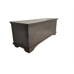 18th century oak sword chest or coffer, hinged lid with moulded edge and iron fittings concealing candle box and main compartment, the front with studwork spelling 'TC 1750', raised on bracket feet