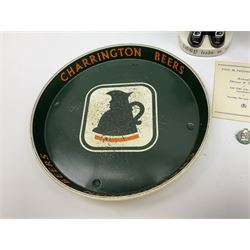 Pair of Royal Doulton Toby Ale Jugs, produced in 1934 for Charrington Ales, together with two circular metal serving trays advertising Charrington brewery, a Charrington badge awarded for 25 years of service and a 1949 menu Fox & Nicholl Ltd annual dinner dance at the toby jug hotel.  