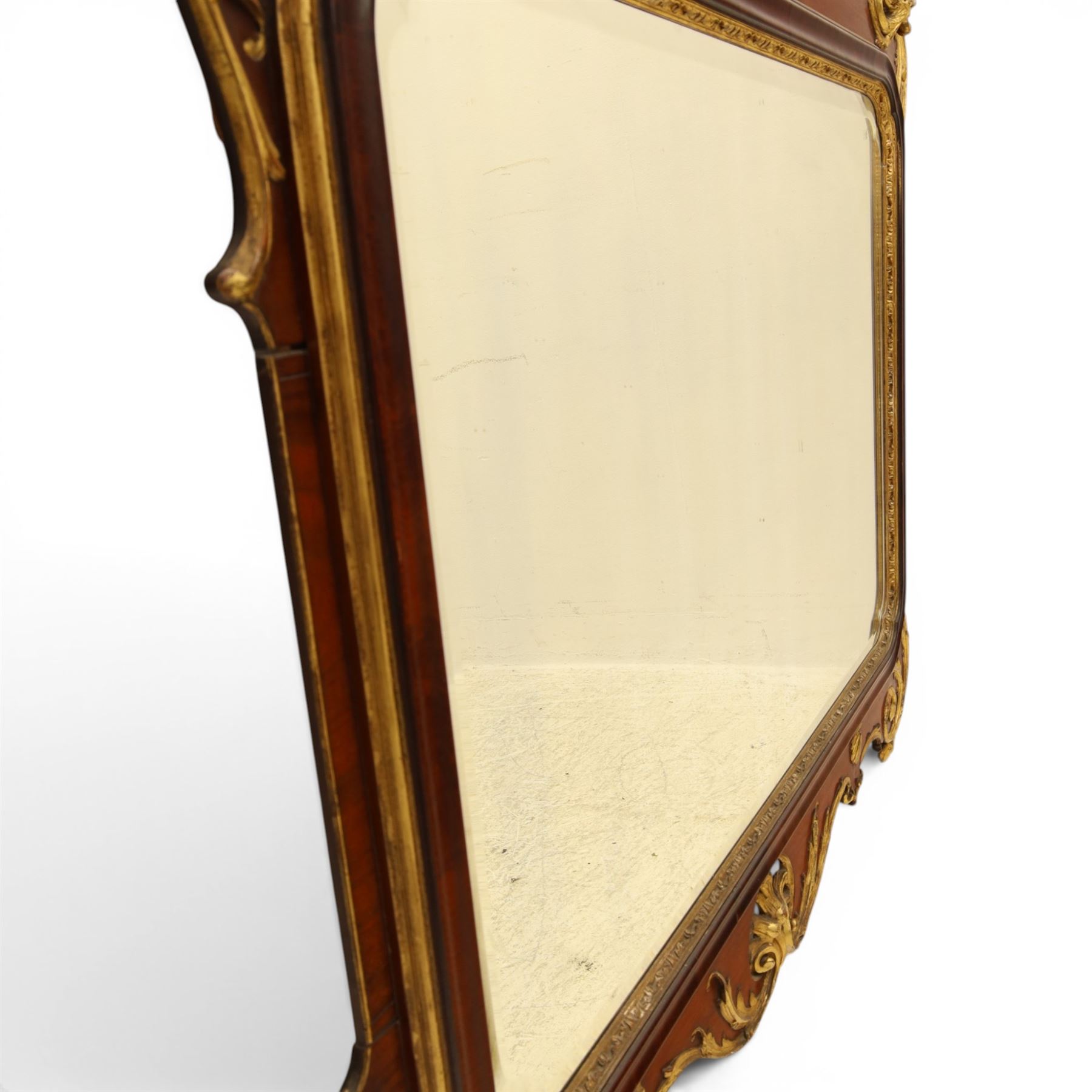 Large George III mahogany wall mirror, parcel gilt shaped frame with scrolling acanthus, shell and foliate decoration, surmounted by carved gilt ho-ho bird, rectangular mirror plate within moulded border, shaped apron with gilt scroll terminals, removed from a Scottish country estate