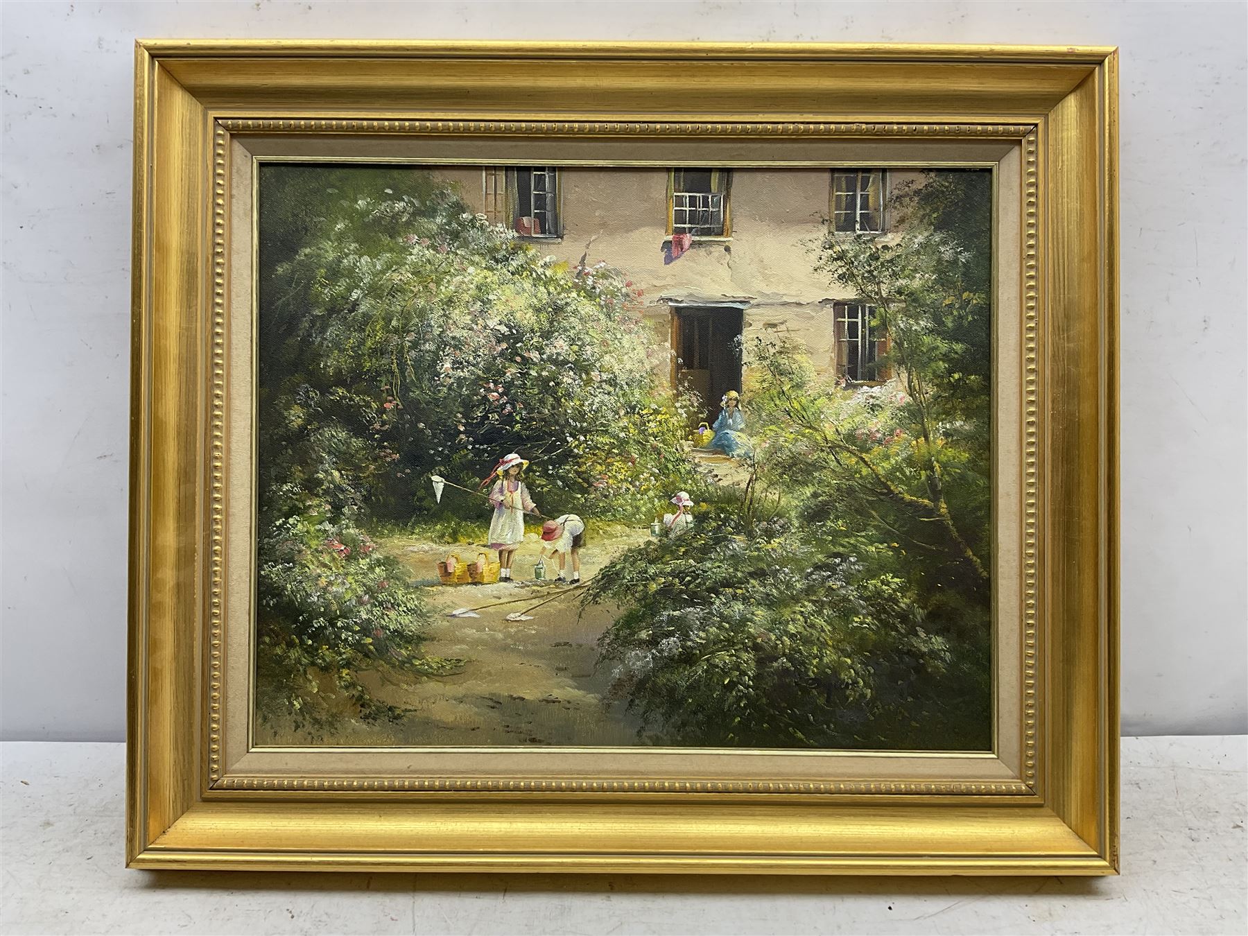 Edward 'Ted' Dyer (British 1940-): Children in the Garden, oil on canvas signed 40cm x 50cm