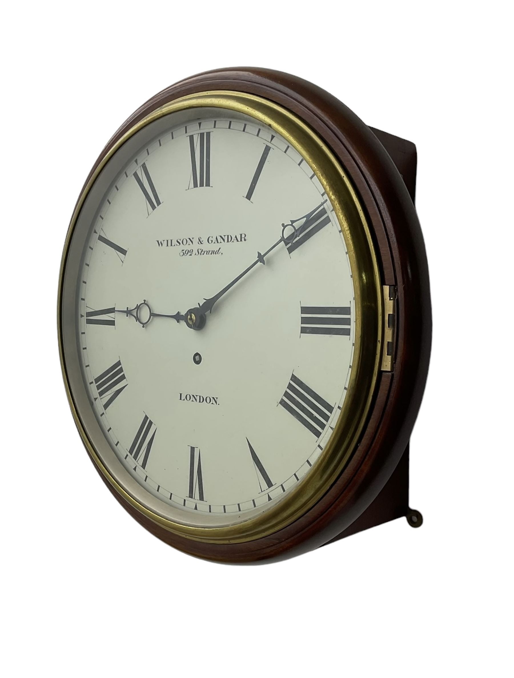 Wilson & Gandar of London -  Fine 19th century fusee timepiece wall clock, mahogany case with a cast brass bezel and 12” painted dial, Roman numerals, minute track and fine pierced moon hands, wire fusee driven movement with curved shoulder movement plates and a recoil anchor escapement. With key and pendulum. Wilson & Gandar are recorded as working in The Strand, London, 1851-75.