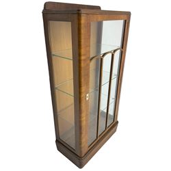Early 20th century walnut display cabinet, single astragal glazed door enclosing three glass shelves, skirted base