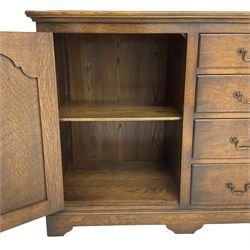 Georgian design oak sideboard, enclosed by arch panelled door and fitted with two short and three long drawers