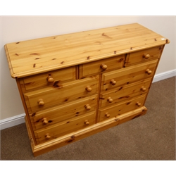  Solid pine chest, moulded top, three short and six long drawers, plinth base, W126cm, H92cm, D44cm  