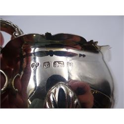 Early 20th century silver sauce boat, of typical form with shaped rim and acanthus capped flying C scroll handle, upon three palmette mounted hoof feet, hallmarked Thomas Edward Atkins, Birmingham 1915, including handle H8.5cm