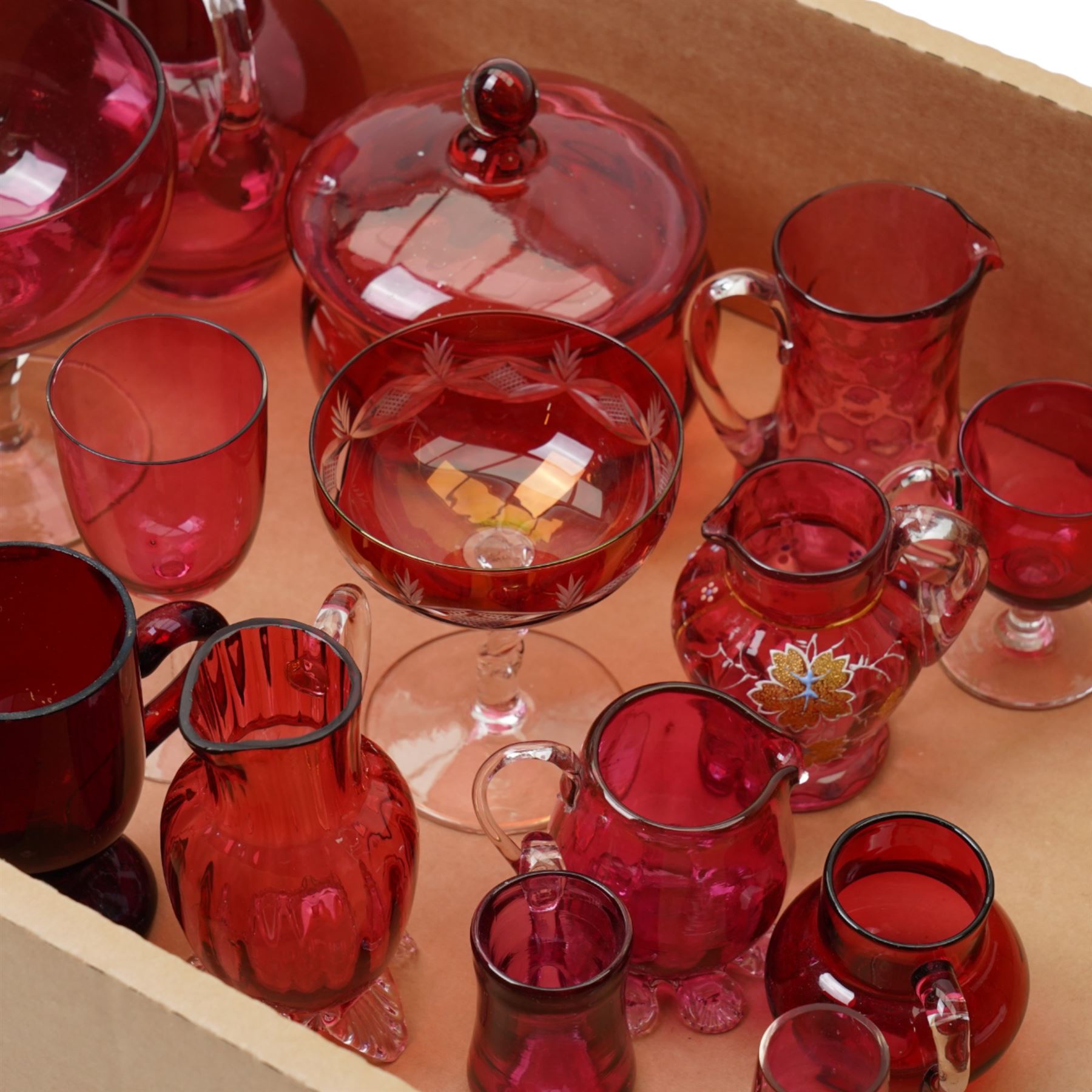 Cranberry glass claret jug with enamelled decoration, enamelled cranberry glass jug, cranberry glass bowl and jug and other cranberry glass items