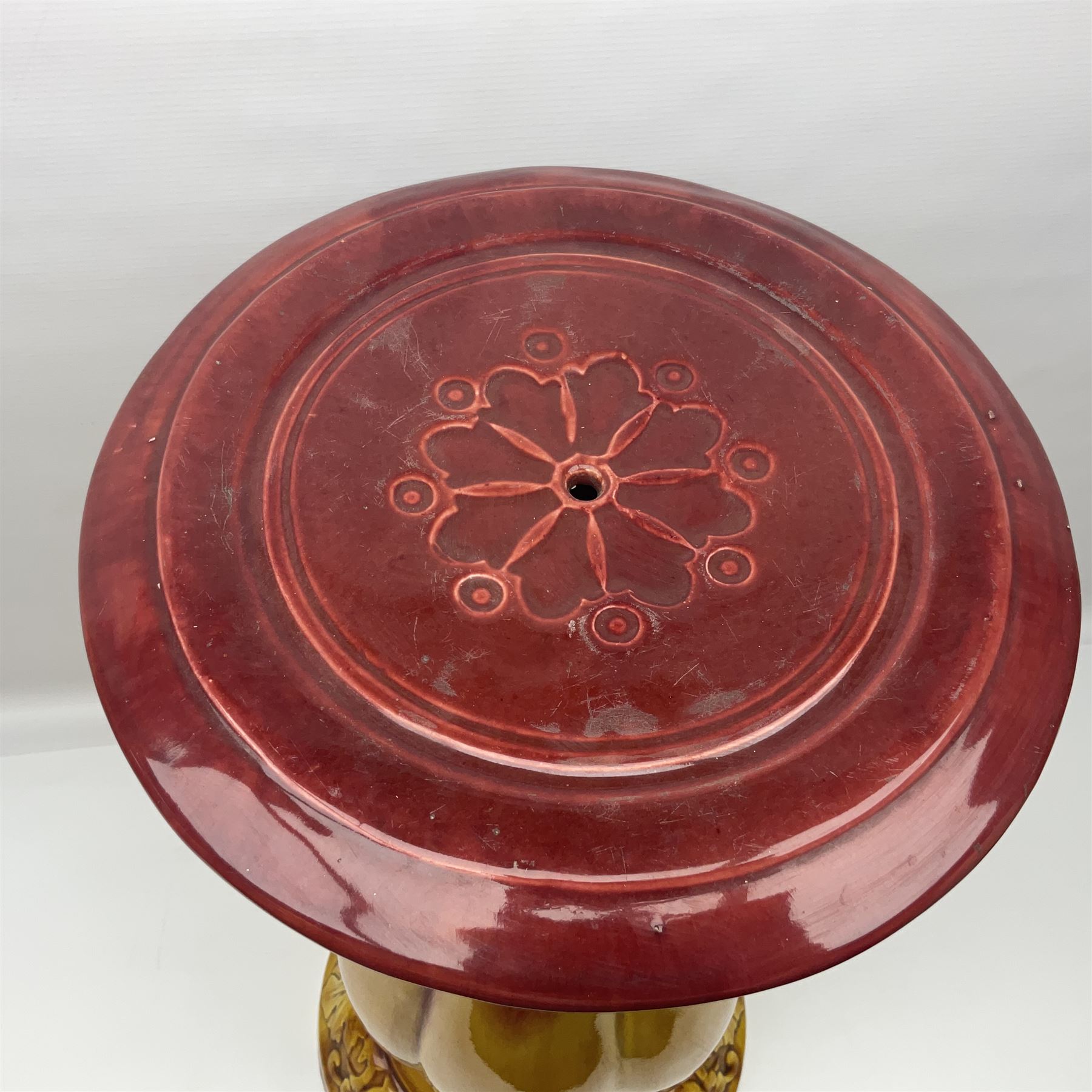 Bretby Jardiniere and stand, with foliate and foliage decoration with a red and yellow ground, impressed mark beneath H94cm