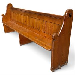 Early 20th century stained pine ecclesiastical church pew, the shaped end supports flankin...