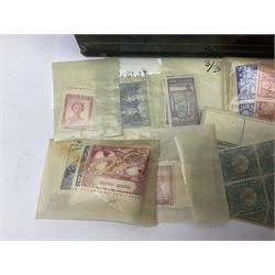 Great British and World stamps in packets, including New Zealand, Australia, Hong Kong, South Africa, Malta, Nigeria etc, housed in a vintage cash tin