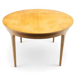 Sutcliffe of Todmorden - mid 20th century ‘S-Form’ teak dining table and chairs, the circular storable extending table with plain veneered top on tapered supports, together with matching dining chairs upholstered in black vinyl, with curved slat backs and shaped front supports, reflecting the sleek organic styling characteristic of 1960s British modern furniture design (Chairs H 93cm, W 46cm, D 46cm) (Extended 168cm)