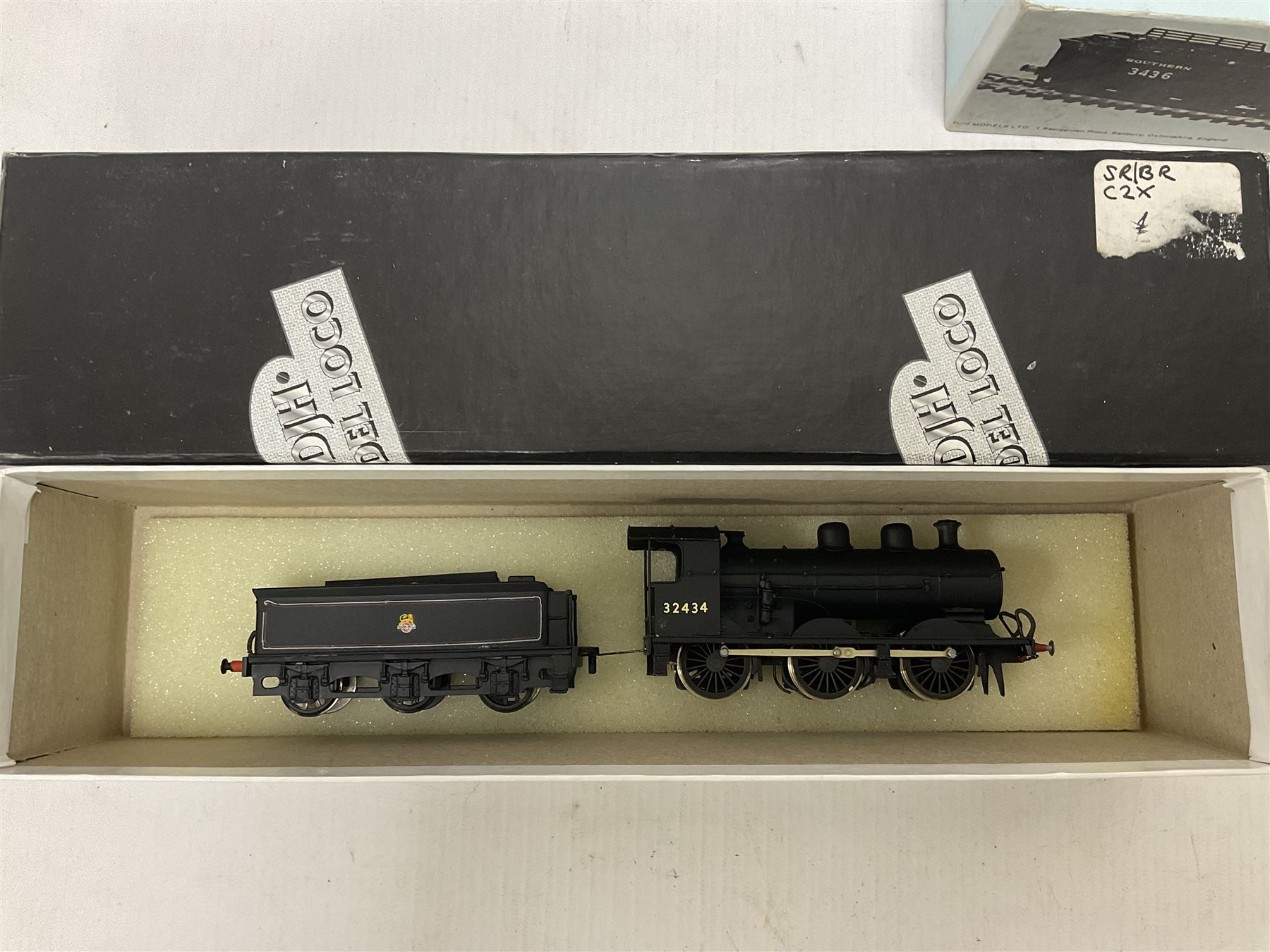 ‘00’ gauge - two kit built steam locomotive and tenders comprising Class 0395 Jumbos 0-6-0 no.30566 finished in BR black; Class C2X Large Vulcans 0-6-0 no.32434 finished in BR black; both with DJH Models boxes (2) 