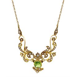 Edwardian peridot and split pearl necklace, central emerald cut peridot with open work foliate design split pearl surround, on trace link chain, stamped 15ct