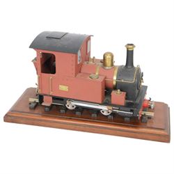Roundhouse Gauge 1 remote controlled 0-4-0 tank locomotive, in red livery, on wooden plinth