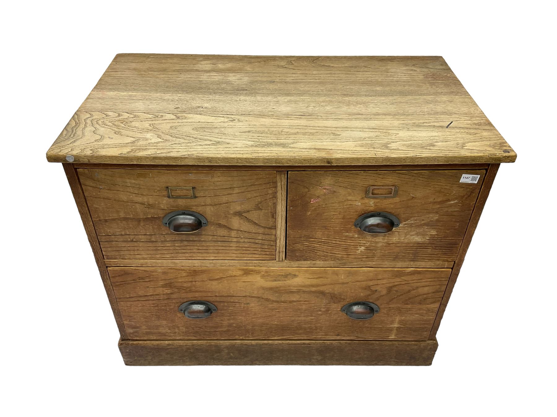 Early to mid-20th century oak chest, fitted with two short drawers over one long drawer, raised on plinth base