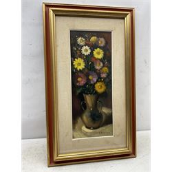 Alfredo Bonciani (Italian 1902-1988 ): Flowers in an Earthenware Vase, oil on board signed, artist's studio label verso 49cm x 19cm