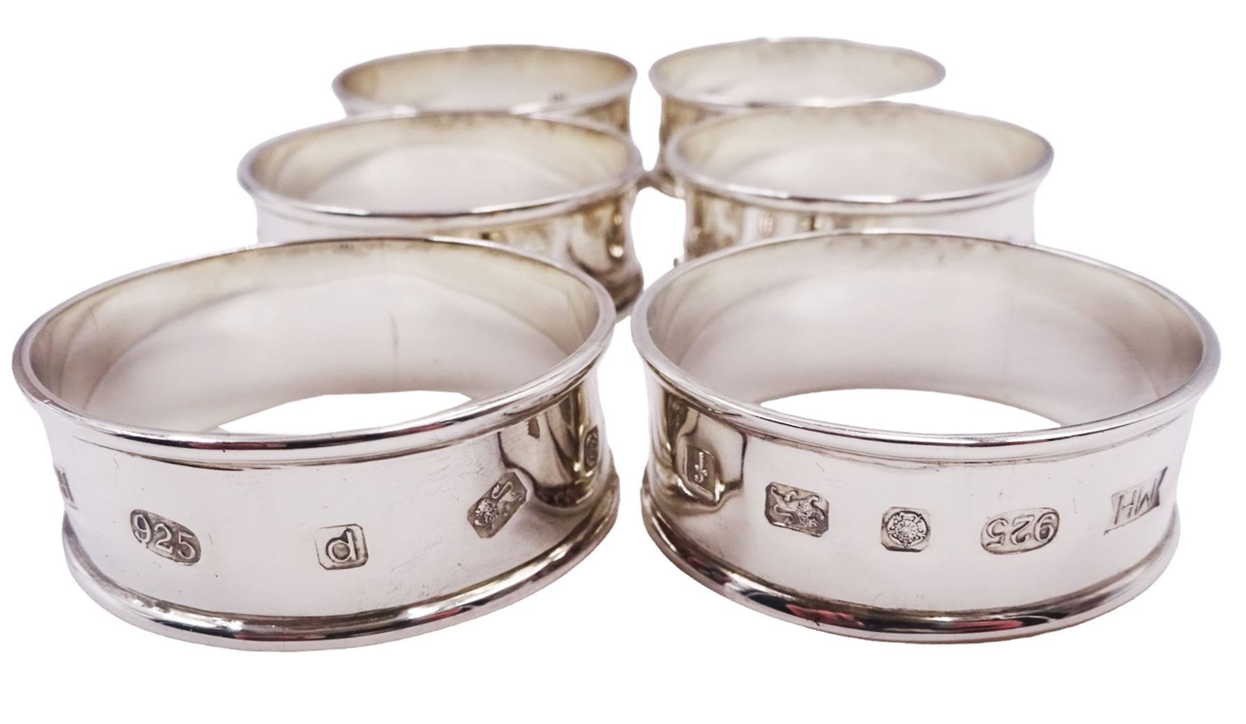 Set of six modern silver napkin rings, with large decorative hallmark