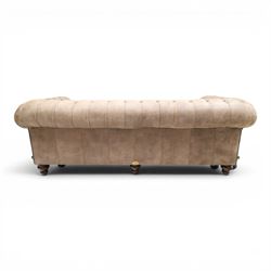 Distinctive Chesterfield - Chesterfield upholstered in taupe leather, deep button back and arms, loose seat cushions, raised on dark stained supports 