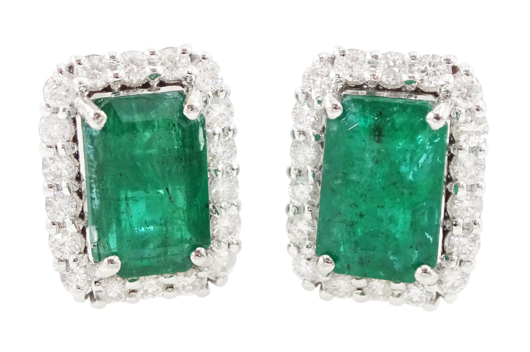 Pair of 18ct white gold octagonal cut emerald and round brilliant cut diamond stud earrings, stamped, total emerald weight approx 3.00 carat
