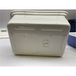 Emile Henry covered casserole dish of oval form in two tone brown and cream, no. 03.06, together with cast iron Nomar twin handled lidded casserole dish of oval form in navy, and other ovenware including Flintware ICTC, largest L35cm