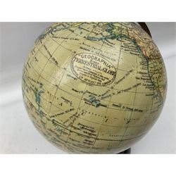 Early 20th Century 'Geographia' 8 inch Terrestrial globe, 167 Fleet Street London, mounted on a brass half meridian and raised on stepped brown Bakelite base, H30cm