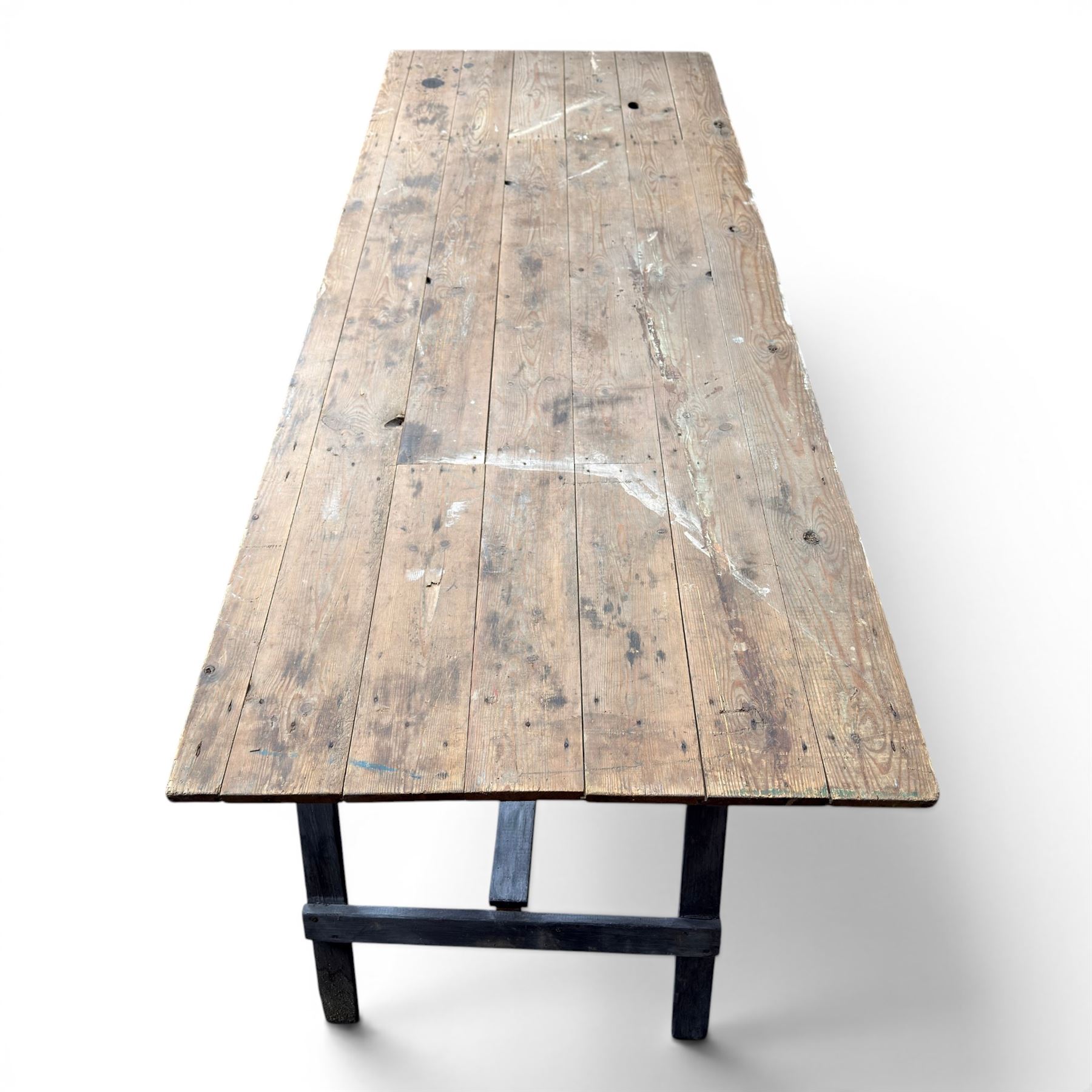 Vintage wooden plank trestle table, on two painted folding stands