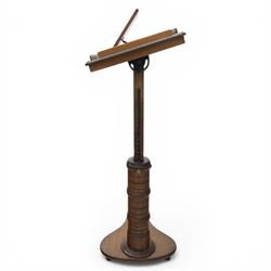 Late Victorian mahogany adjustable reading stand, the rectangular top with moulded and rounded edge and gallery upon a adjustable turned column support, and shaped base