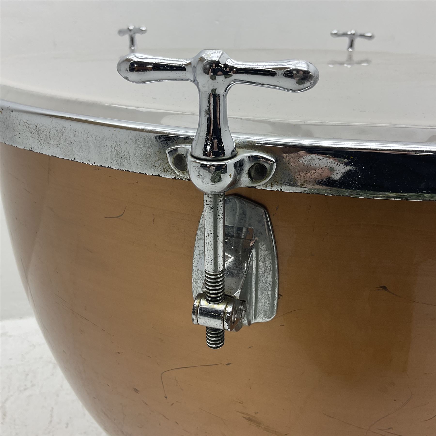 Timpani drum with coppered finish to the bowl, three adjustable tubular legs 'Marked Made in England 71 260' and Remo head D75cm 