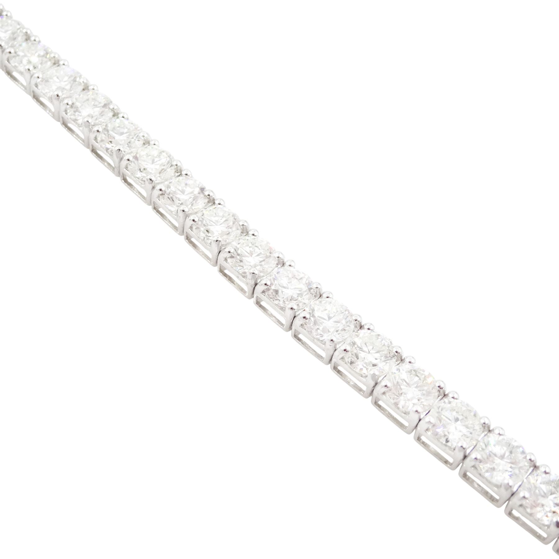 18ct white gold diamond bracelet, forty round brilliant cut diamonds , in a four claw setting, stamped 18K, total diamond weight 12.26 carat, with World Gemological Institute report