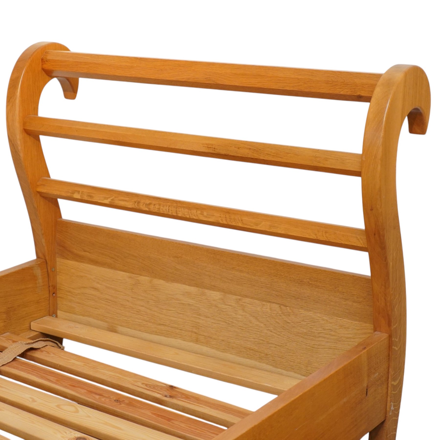 Unicornman - pair of craftsman-made oak single beds, of sleigh shape with scrolled head and foot-boards with octagonal stretchers, slatted base, raised on inward-splayed squared supports, applied with carved unicorn signature, by Geoff Gell of Coxwold
