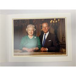 HM Queen Elizabeth II and HRH the Duke of Edinburgh - signed 1997 Christmas card with two gilt cyphers to front and colour photographic portrait inside,  signed Elizabeth R and Philip with manuscript date 1997 below