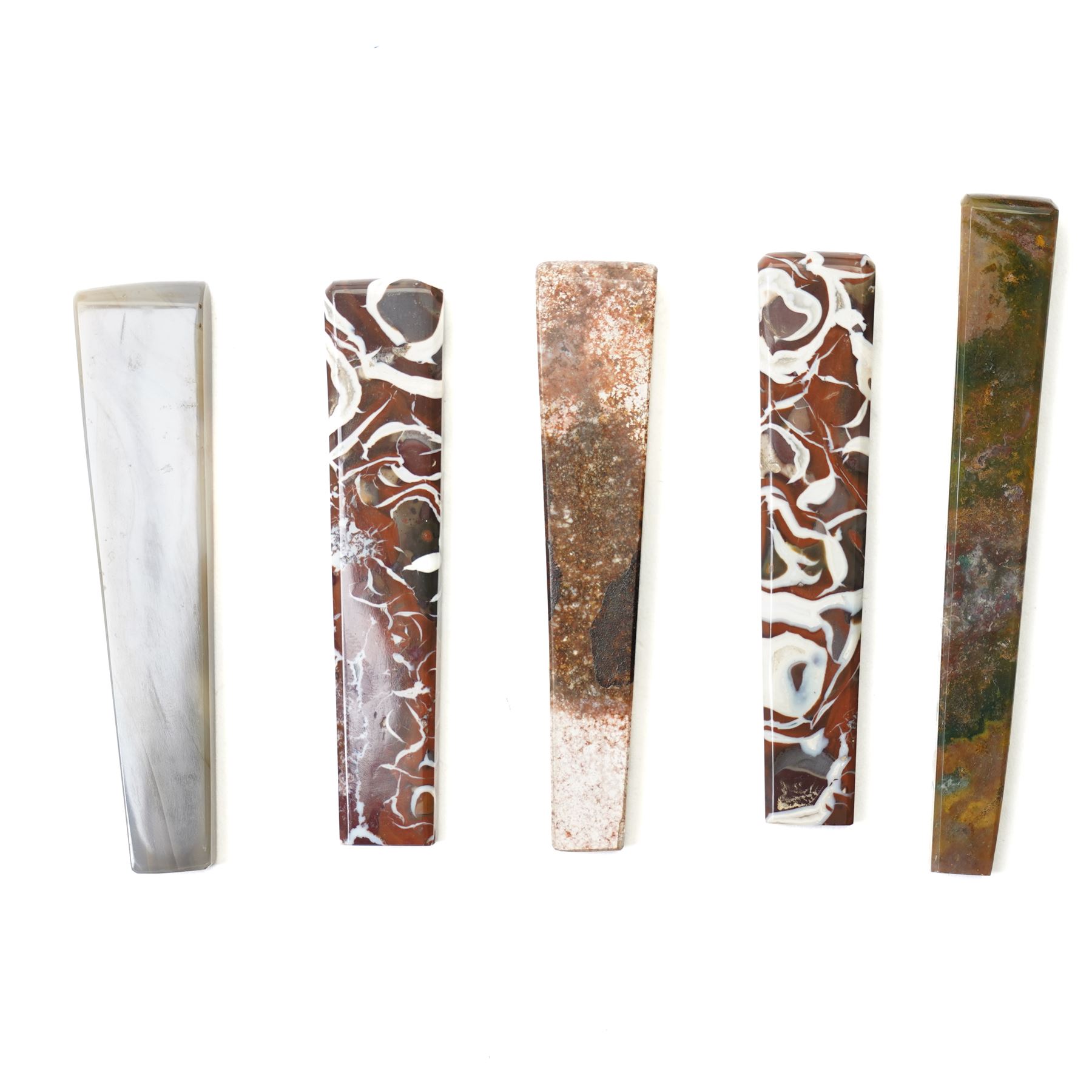 Collection of ten 19th century agate knife handles of varying designs, paperweight of octagonal design, swivel fob seal and a pinchbeck seal