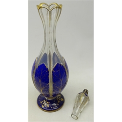 Large 19th century Bohemian blue & white overlay glass footed decanter, the sectioned body gilded with stiff leaves and scroll foot, H47cm     