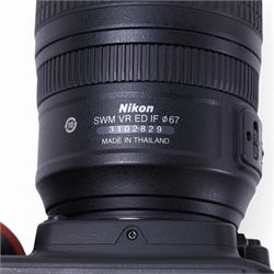 Nikon D90 DSLR camera body, serial no. 8230680, with a Nikon ED AF-S Nikkor 70-300mm 1:4.5-5.6 G lens, serial no. 3102829, with battery and Nikon Quick Charger, in carry case with other accessories including hoods, caps and filters