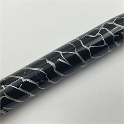 Three Conway Stewart fountain pens, comprising Cracked Ice 28 pen, the black and pearl white barrel engraved Conway Stewart 28 and double banded cap, with gold nib stamped 14ct, together with a Conway Stewart 75 lever fill pen, the green marble barrel and cap with single band and gold nib stamped 14ct and Conway Stewart 55 lever fill fountain pen with black barrel and cap with single broad band and two narrow bands with gold nib stamped Duro 14ct, largest L13cm