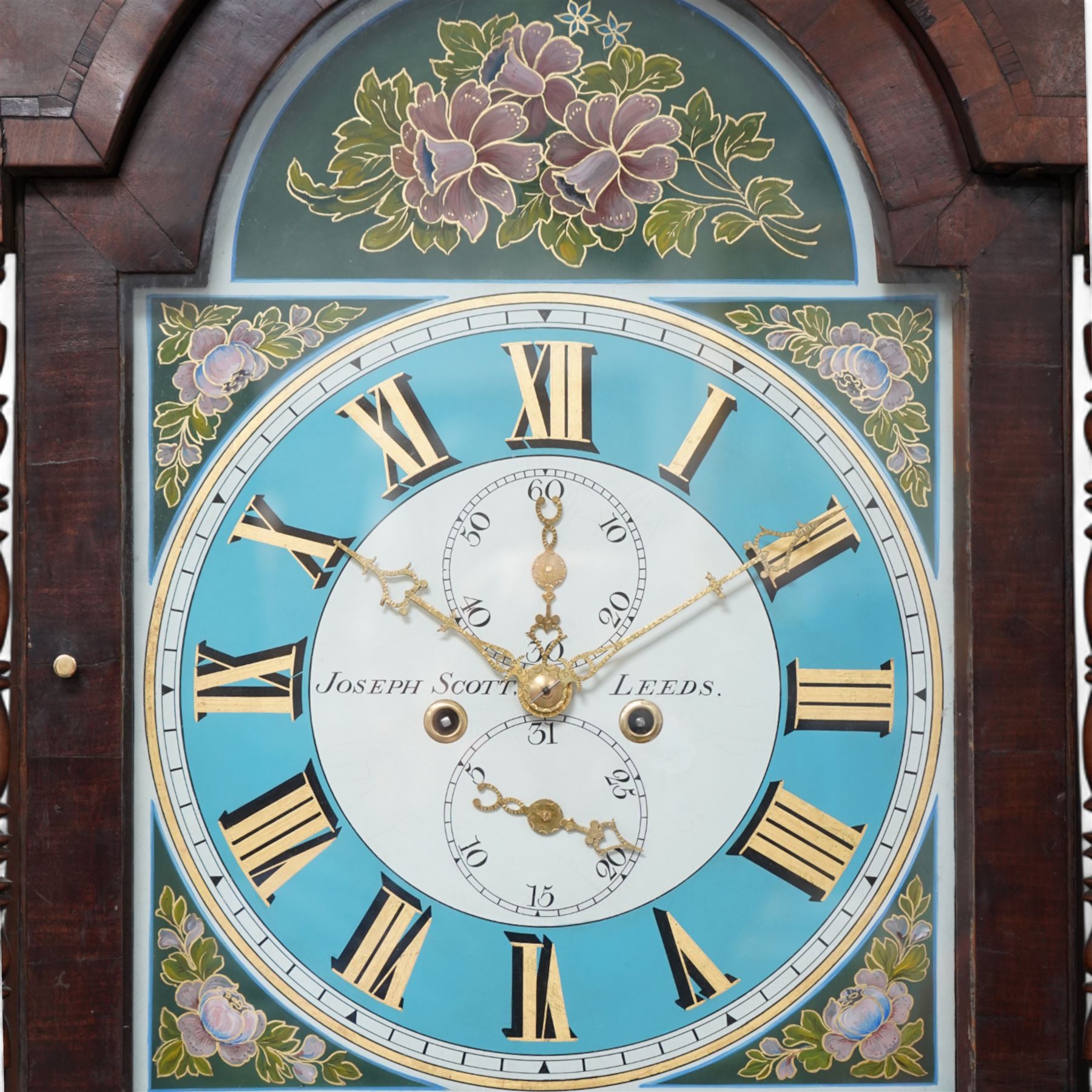 Joseph Scott of Leeds - 8-day oak and mahogany longcase clock c1865, with a swan necked pediment and wooden parterre, break arch hood door flanked by spindle turned pilasters, trunk with reeded quartered columns and a short door with a double spire top, on a deep plinth with crossbanding and raised on bracket feet, painted dial with gold 