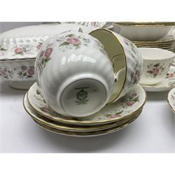 Minton Spring Bouquet pattern dinner and tea service, comprising dinner plates, twin handled tureens with covers, meat platter, teapot, milk jug, sugar bowl with cover, tea cups and saucers, bowls, cake plate, side plates, dessert plates, etc all with printed mark beneath (82)