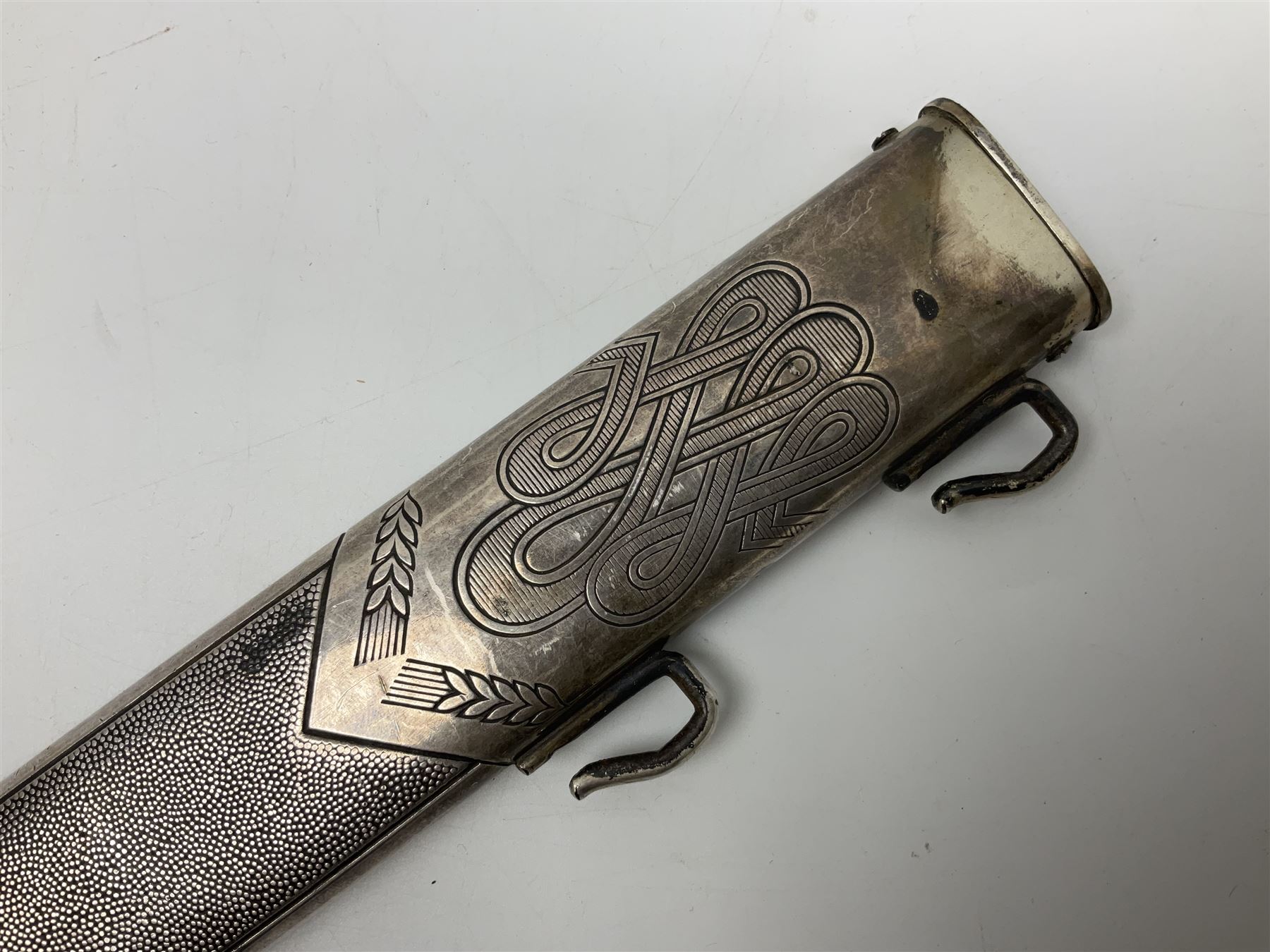 WW2 German RAD (Reichsarbeitdienst) Leader's hewer dagger,  the 25.5cm fullered steel blade engraved Arbeit Adelt (Work Enables) with Eickhorn squirrel maker's mark; scrolling cross-piece, mahogany grip and eagle pommel; in decorative plated scabbard L40cm overall.