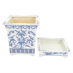 Chinese blue and white planter and stand, each of square slightly tapering and flared form, the planter decorated with two dragons and blossoming peonies, between stylised borders, the stand decorated with flower heads and vines, planter H30cm W29cm, stand H7cm D28.5cm