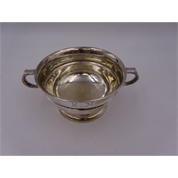 Modern silver twin handled porridge bowl, of circular waisted form, engraved with initials to body, with capped C handles and upon a spreading circular foot, hallmarked Viner's Ltd, Sheffield 1960, H6.2cm