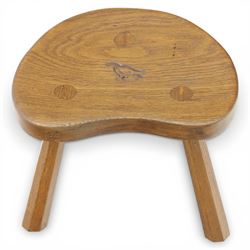 Eagleman - small oak calf stool, raised on three octagonal supports with signature Eagle motif to the seat from the workshop of Albert Jeffray, Sessay