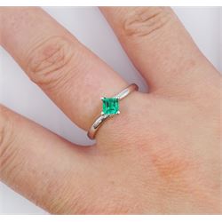 18ct white gold emerald ring, four claw set with a single square cut emerald of approx 0.30 carat, stamped 750