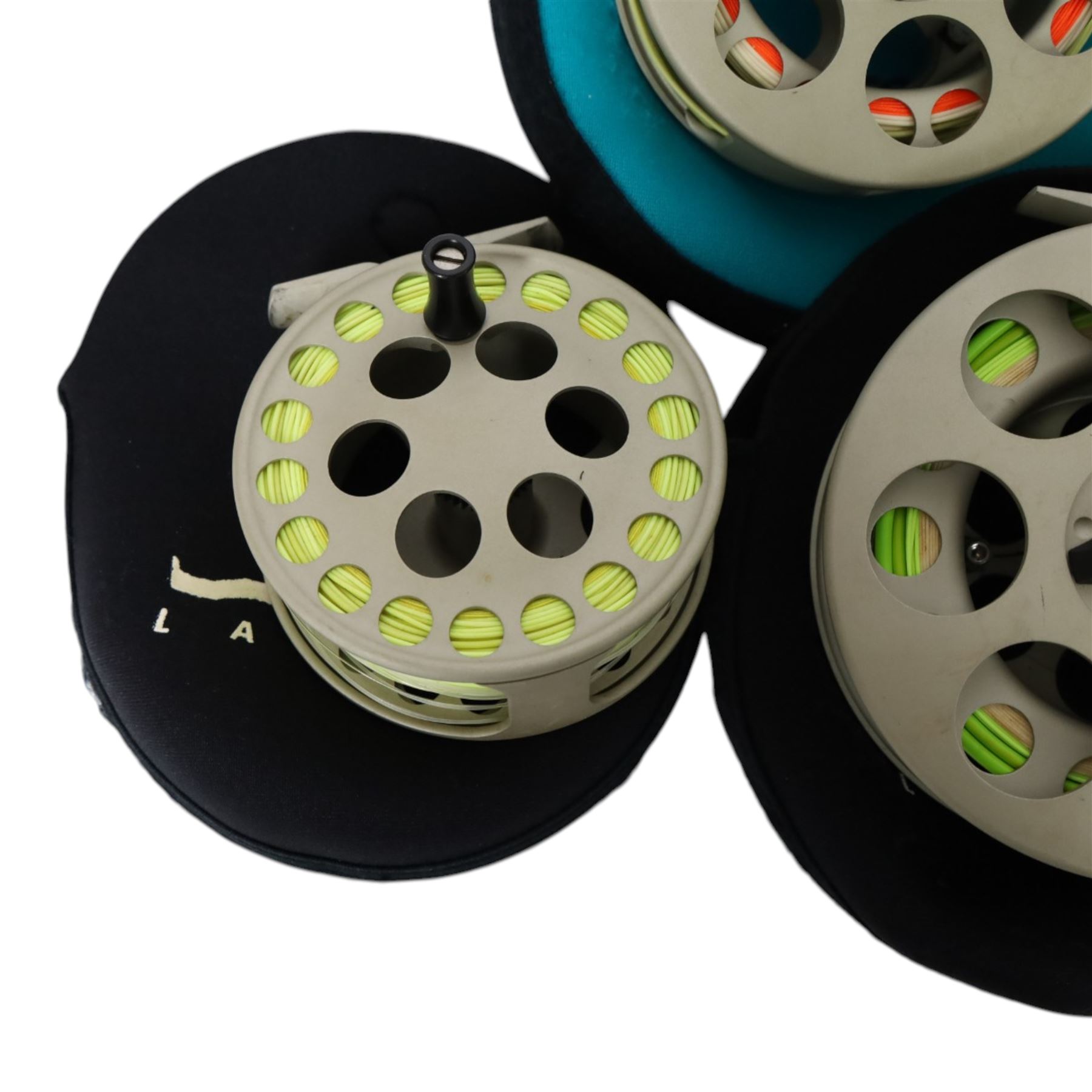 Five Lamson Litespeed fly reels, comprising LS4, two LS2, two LS3.5, all within Lamson soft pouches