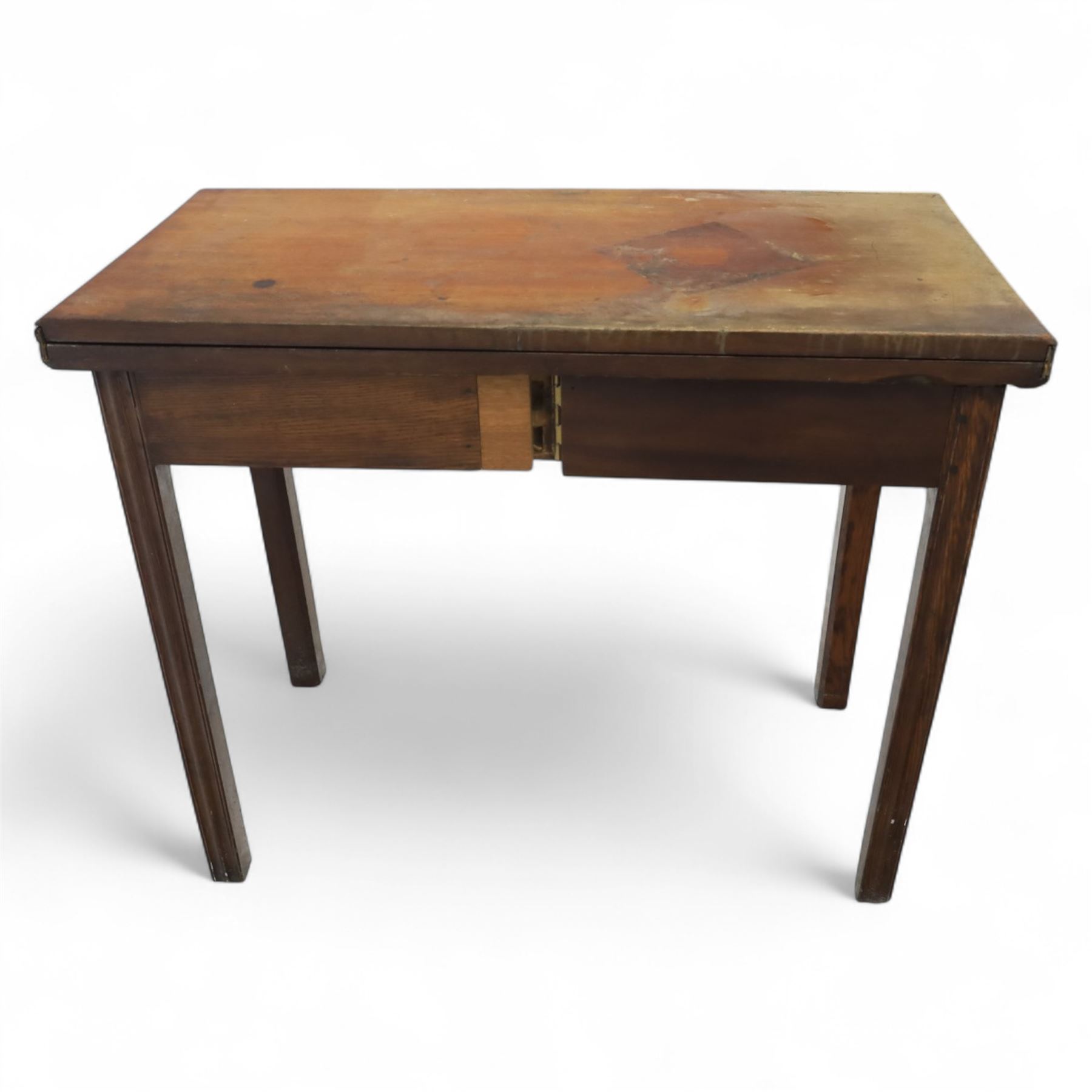 Georgian mahogany fold-over tea table, rectangular top with moulded edge over single frieze drawer with brass handle plate, on square tapering supports with gateleg
