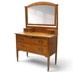 Manner of Liberty & Co. - Arts & Crafts oak dressing chest, the arched swing mirror with r...