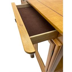 Yew wood sideboard, rectangular top with mahogany and ebony stringing, fitted with two drawers over three glazed cupboard doors enclosing glass shelves